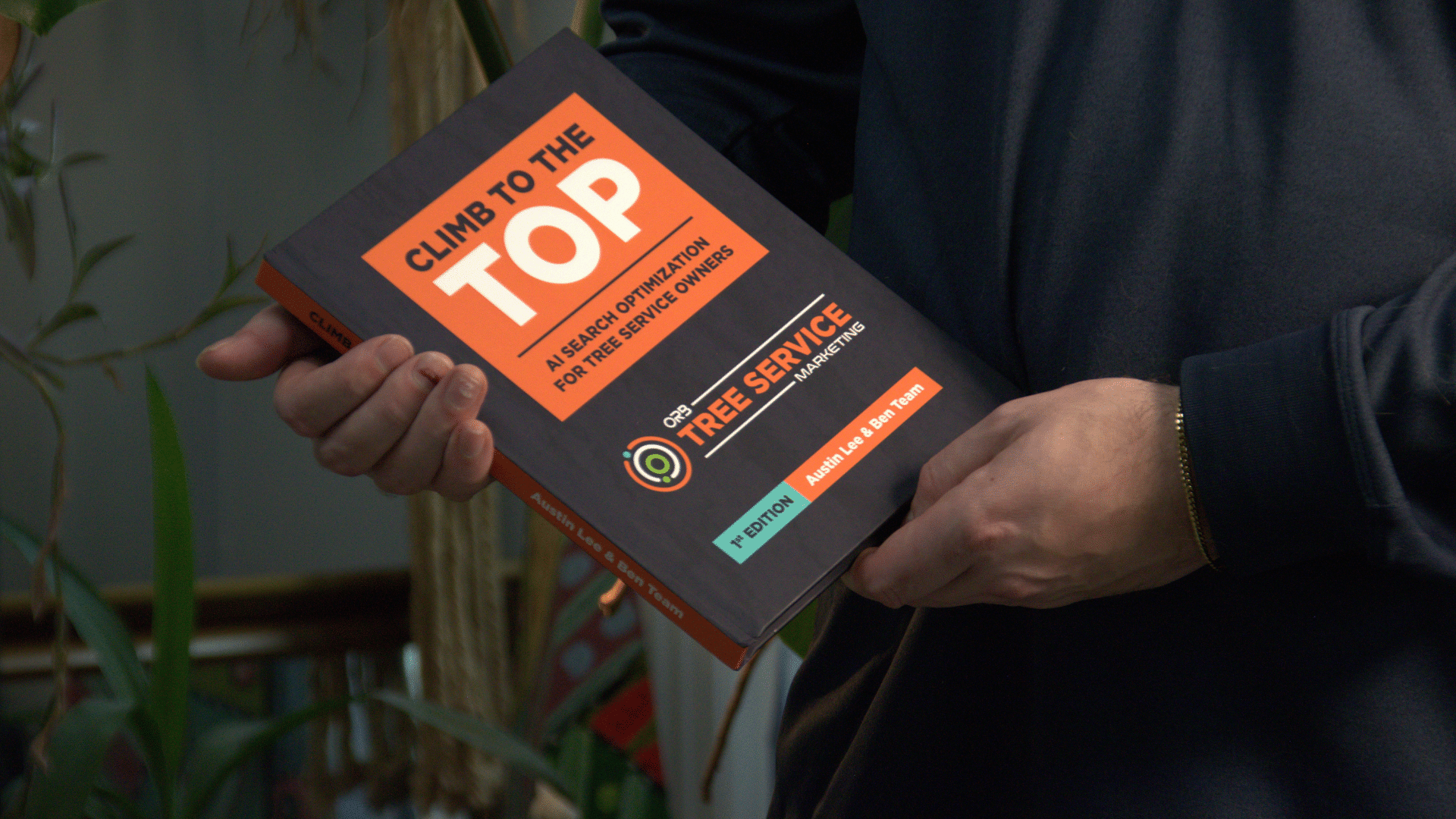 Austin holding Climb to the Top AI Search Optimization for Tree Service Owners Book